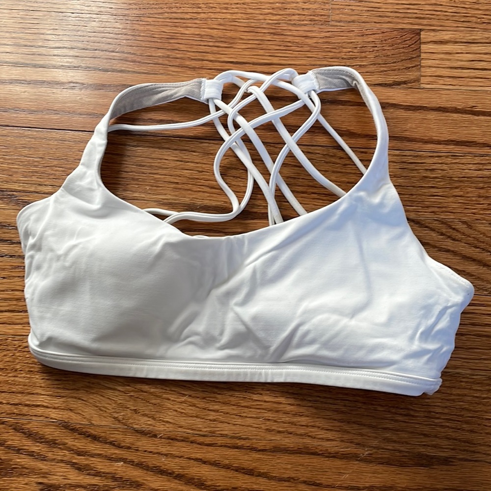 FREE TO BE WILD WHITE BRA. Great condition, minor fraying on back strap
